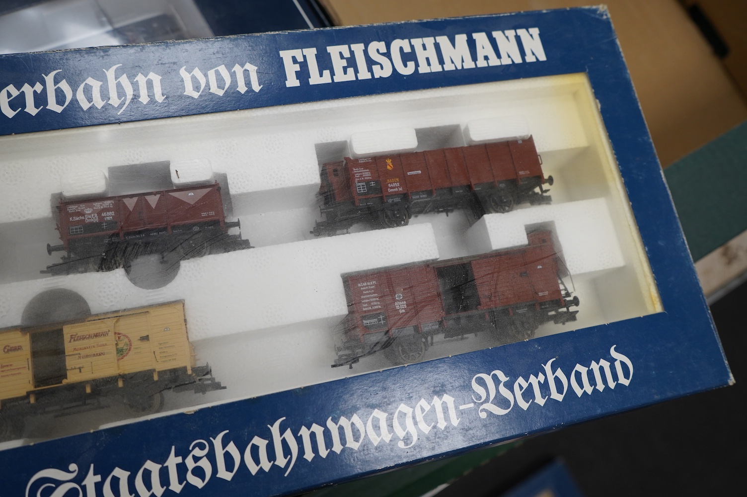 Three boxed Fleischmann HO gauge railway train sets; a passenger set with a 4-6-4T Loco and three clerestory coaches (4887), and two goods train sets, both comprising of a locomotive and an assortment of freight wagons (